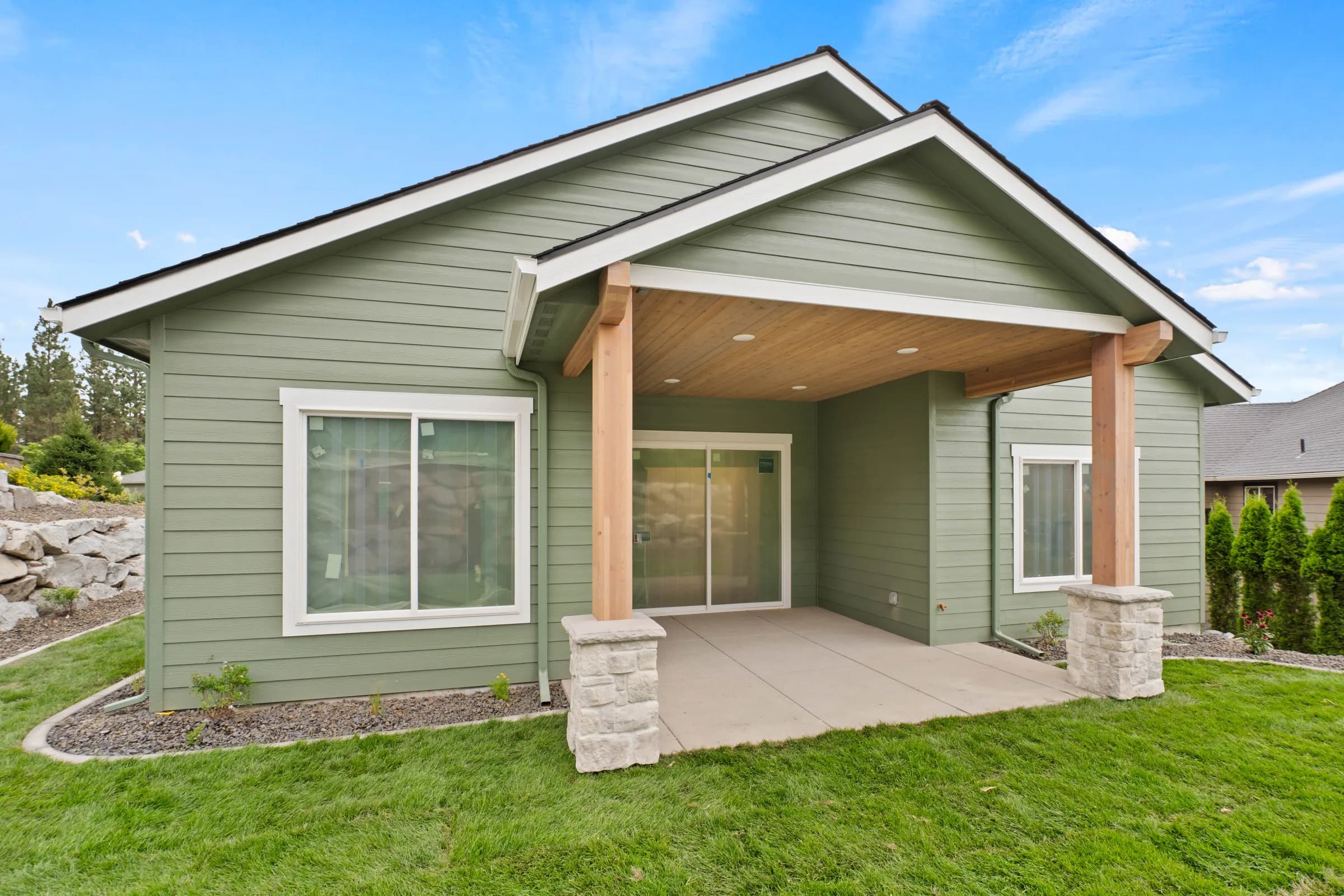Covered back porch with cedar posts on a JM Homes craftsman