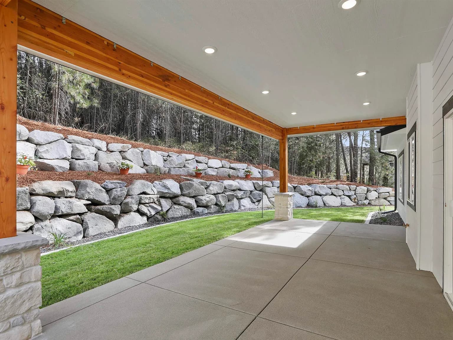 Covered back patio with timber beams on a JM Homes build